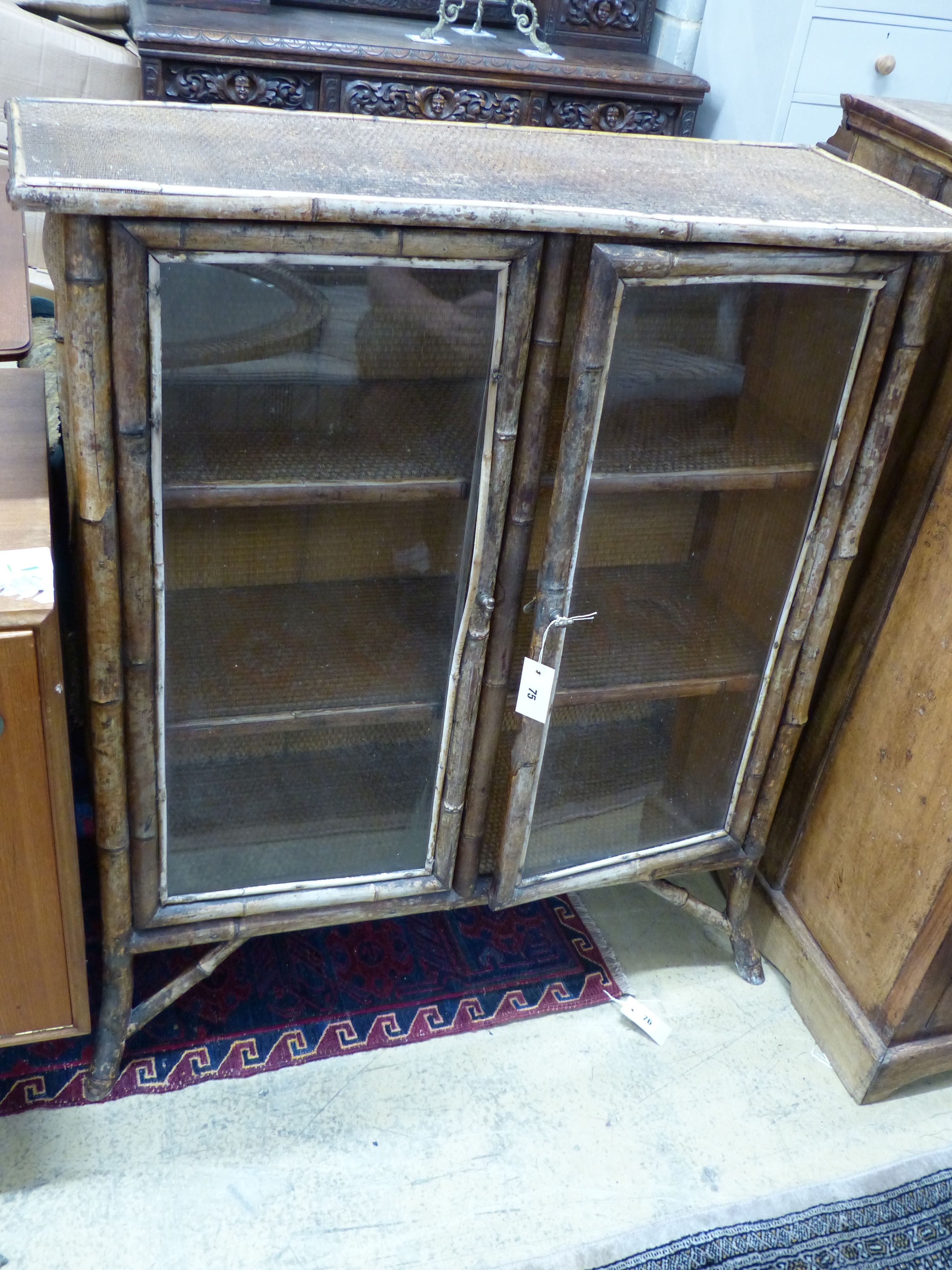 An Edwardian bamboo and cane bookcase, width 91cm